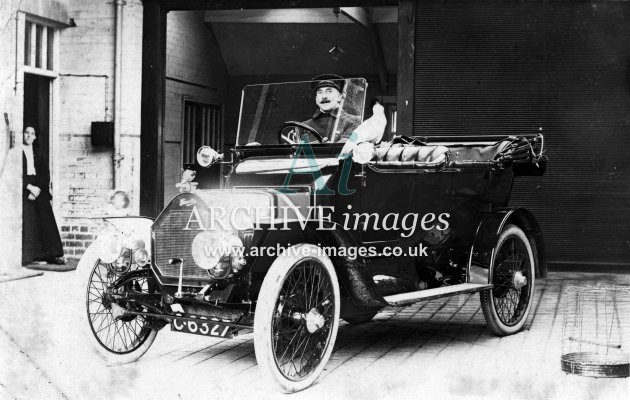 Motoring vintage car with parrot c1910 CMc