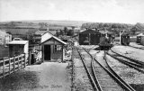 The Plymouth, Devonport & South Western Junction Railway's terminus at Callington circa 1908, with a train arriving and a second loco in the engine shed behind.