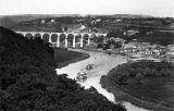 Two River Tamar paddle steamers head upstream from Calstock in August 1907, with the nearly completed viaduct in the background.