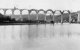 A view of Calstock Viaduct under construction in early 1907, looking down the River Tamar towards Plymouth. Goss's boatyard can be seen on the left.