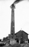 Steeplejacks at work on a Somerset colliery chimney. This is one of the Coleford area collieries. Steeplejack Company FC Bellis of Augusta St, Poplar, E London.