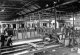 Gloucester Railway Carriage & Wagon Co Ltd, 1924. Carriage Shop. Underframe under construction in foreground. Metropolitan Railway 'G' Stock carriages being built
