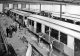Gloucester Railway Carriage & Wagon Co Ltd, 1924. Paint Shops. Metropolitan Railway 'G' Stock carriages being prepared for painting.
