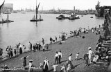 River Thames, Greenwich Reach circa 1908. Spritsail barges and paddlers moored, Greenwich Electricity Works on right