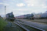 Ex-GWR 4-6-0 No. 6838 Goodmoor Grange heads north at Leominster South End in April 1964, as No. 1420 shunts the yard.