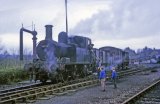 No. 1458 shunts the yard at Kington watched by two small boys on 25th April 1964.