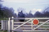 No. 1420 approaching a level crossing on the Kington Branch in May 1964. Possibly Cobnash crossing again