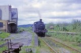 No. 1458 at Titley Junction station on 17th May 1964, with the pw velocipede partially in view in the foreground