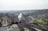 A bird's eye view of the western end of Plymouth station, taken from the top of the DEO Tower, in May 1963. Line to Millbay heading off to left, main line to Cornwall curving away right
