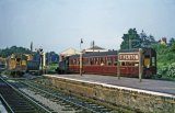 Auto trains crossing at Tiverton in July 1961. No. 1450 has just departed the bay on the right with iots coach, heading for the Junction station.