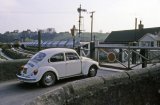 St Blazey crossing closed to traffic as a china clay train is shunted circa 1972. This line leads into Par Harbour. Nice Beetle!