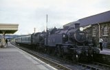 Standard tanks No's 41223 & 4127? arriving at Torrington with a train from Barnstaple on 5th August 1963. One engine and coach will carry on to Halwill Junction, whilst the other loco will work the return service to Barnstaple