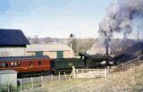No. 3210 works hard as it hauls the 2,20 highbridge-Templecombe train away from West Pennard station on 31st March 1962