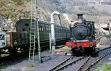 No. W16 pauses to take water whilst running round its train at Ventnor circa 1962