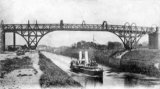 A Paddle Steamer passes beneath Latchford Bridge on the Manchester Ship Canal circa 1905