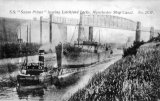The SS Saxon Prince leaves Latchford Locks, beneath the high level railway bridge, under tow on the Manchester Ship Canal circa 1905