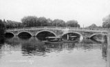 The Ouse Bridge at Bedford circa 1908, with steam pleasure craft about to pass through.