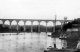 View up river of the newly completed Calstock Viaduct circa 1908. Town or steamer quay on right with sailing ships moored