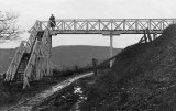 The Plymouth, Devonport & South Western Junction Railway branch to Callington under construction at Calstock circa 1907. Contractor's narrow gauge line in place. The footbridge carried a footpath from the church across the new line. Photo by F Paul