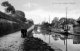 Higher Marple wharf on the Peak Forest Canal circa 1908, with two narrowboats loading alongside.