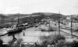 Pentewan harbour from high ground to the east circa 1905. A severn Trow is moored in the centre.
